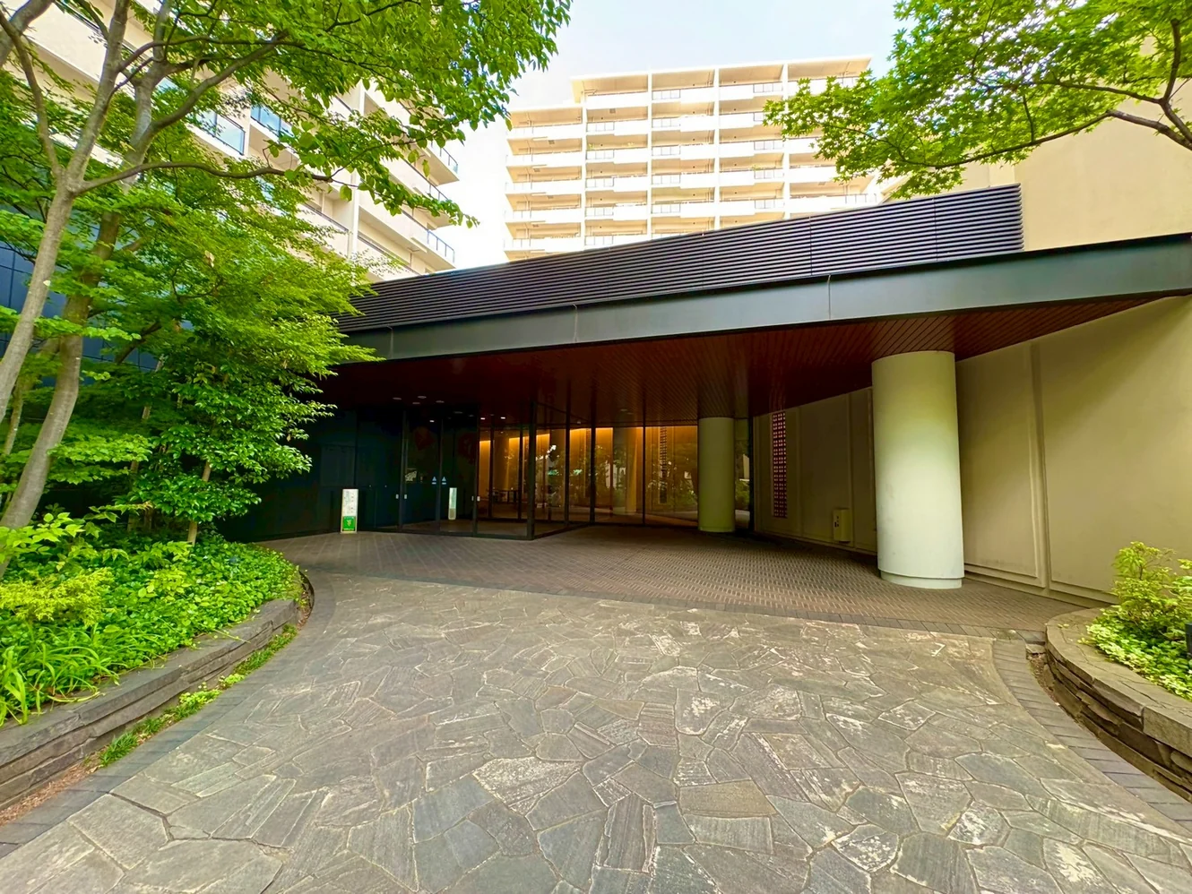 Building entrance approach with the residential blocks behind